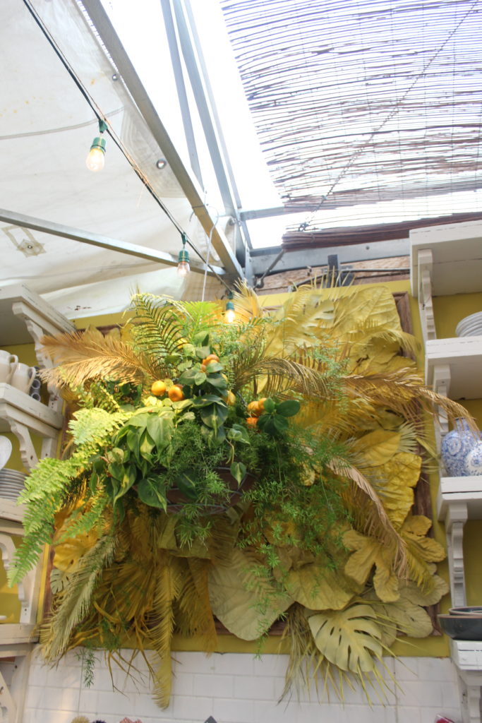 yellow flower and monstera arrangement at Terrain Cafe