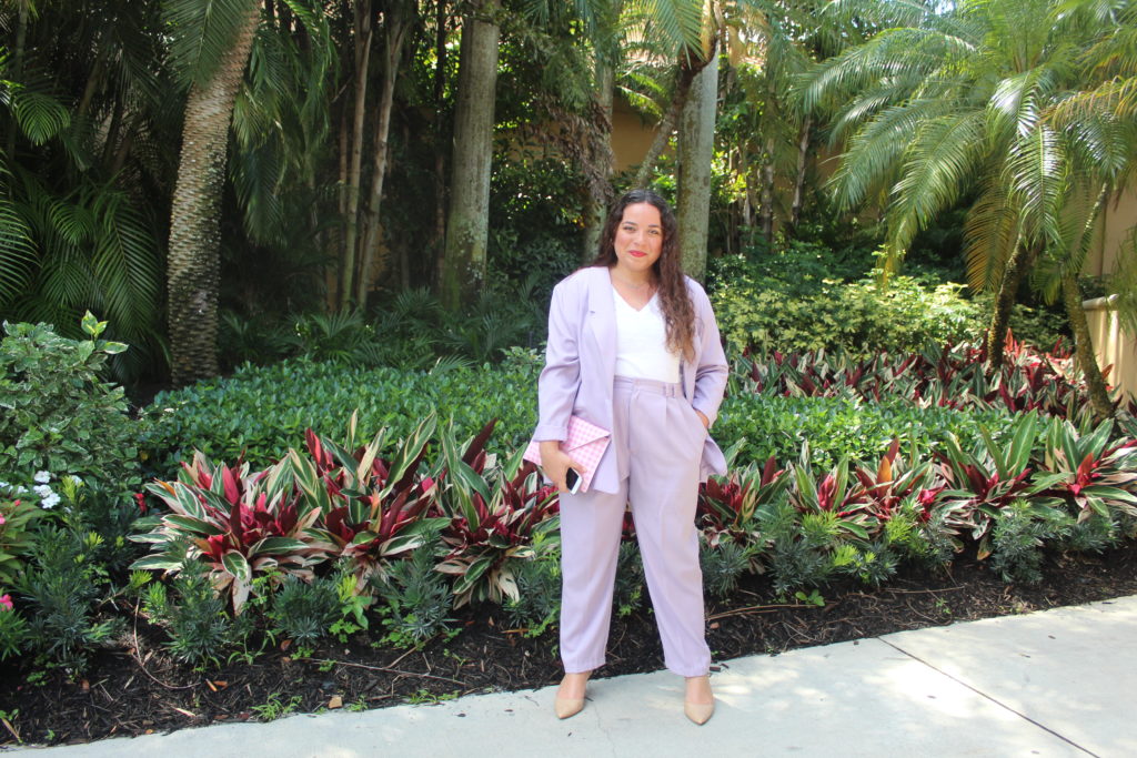 wearing a lavender suit at PGA National Resort