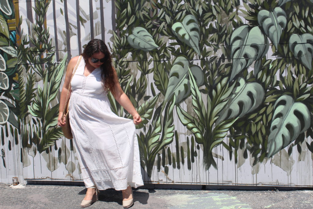 white maxi dress in front of the mural at the Wynwood Walls