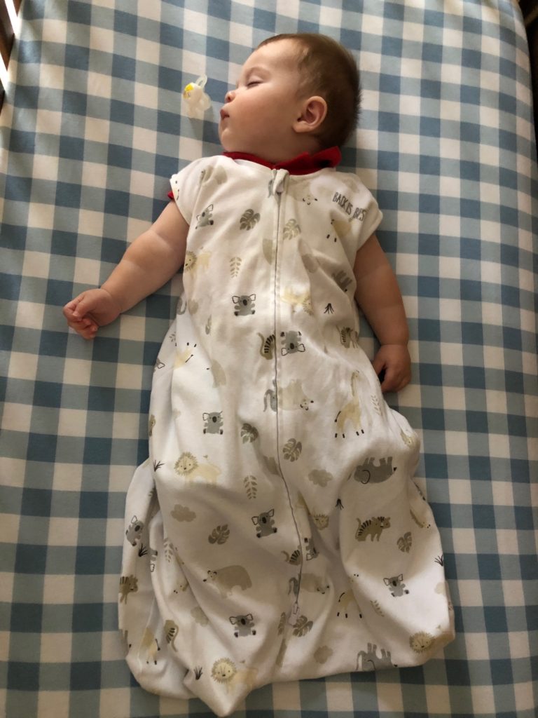 baby sleeping in Halo sleep sack