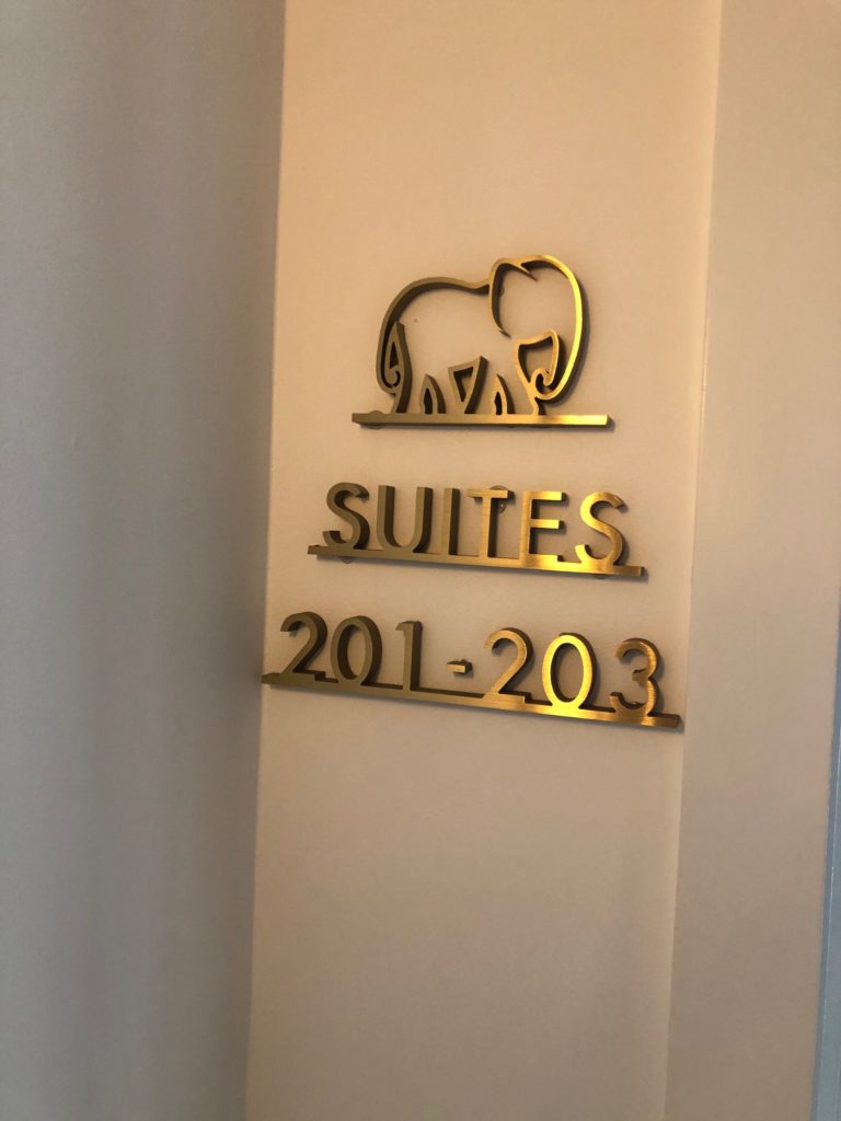 gold elephant hotel room sign