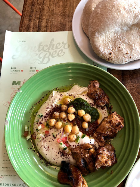 Hummus and chicken from butcher and bee in Charleston