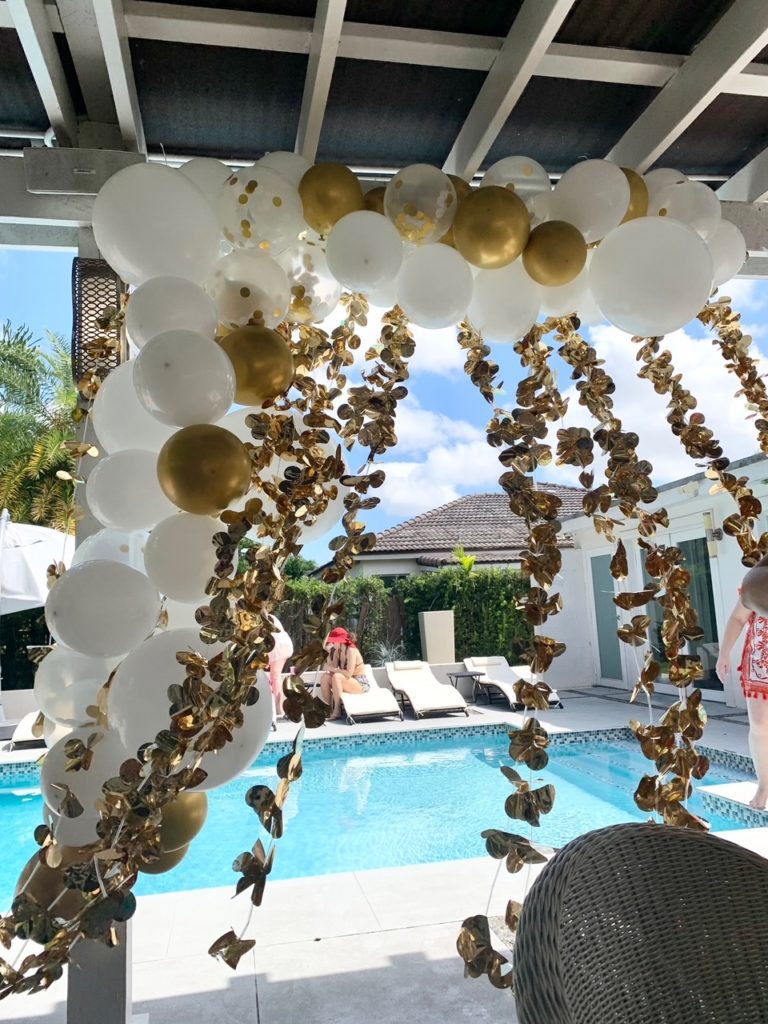 white and gold balloon arch bachelorette decorations